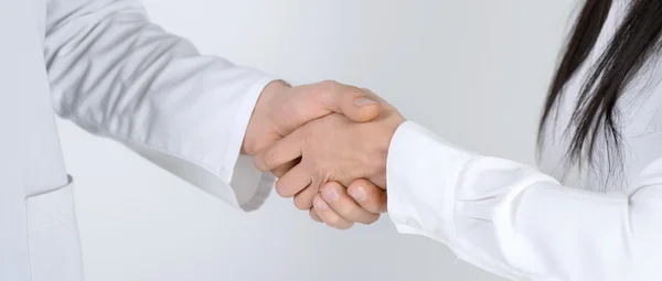 Patient shaking hands with doctor