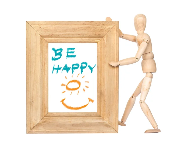 Wooden figure hold square wooden frame with happy smile inside