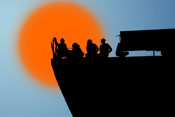 Silhouette of worker at express way construction site