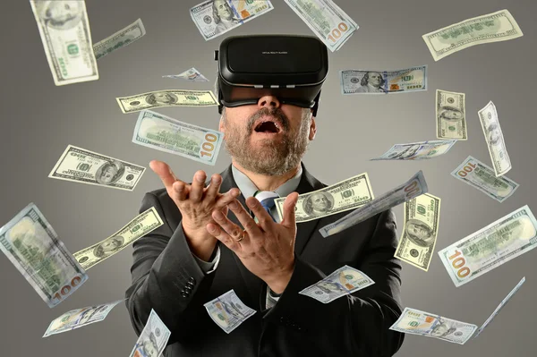 Businessman Using Virtual Reality Getting Money