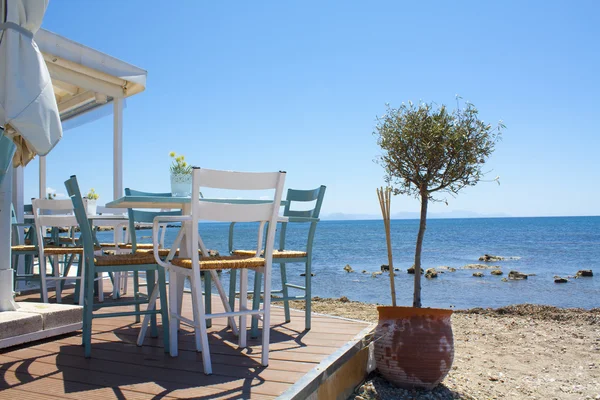 Traditional Greek tavern on the beach. Holidays in Corfu island. Greece
