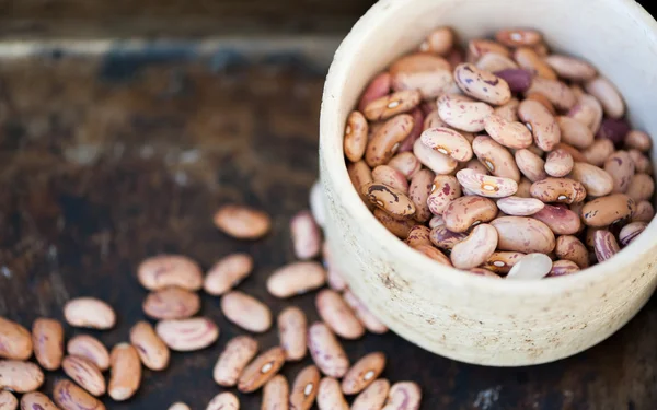 Brown beans on a black background