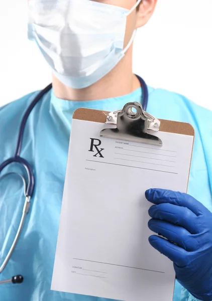 Male doctor standing with folder, isolated on white background