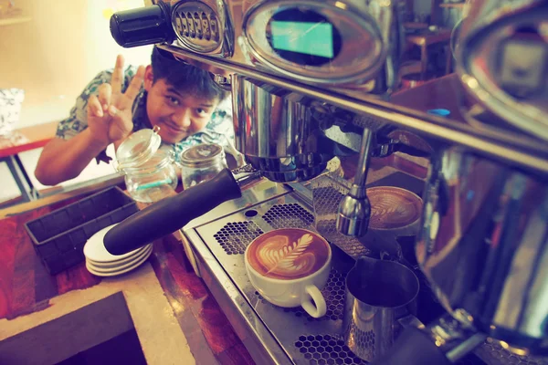 Cup of coffee latte art on the wood background in vintage color