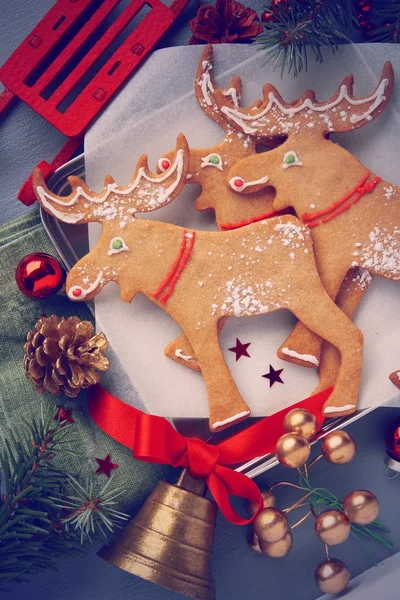 Christmas gingerbread elk-shaped cookies with decoration