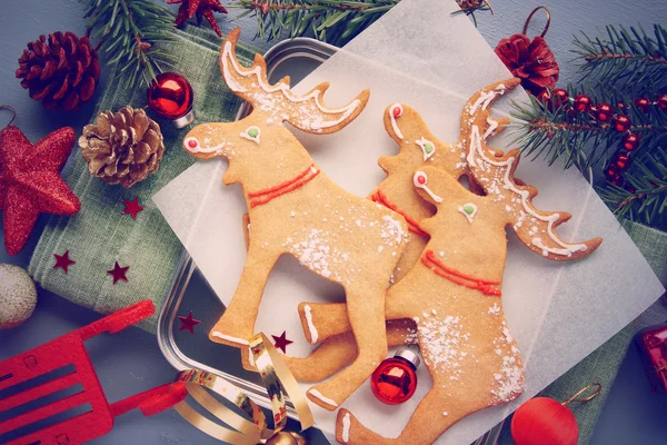 Christmas gingerbread elk-shaped cookies with decoration