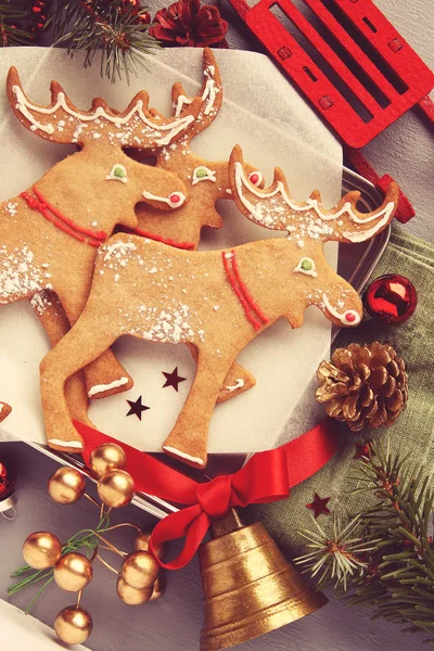 Christmas gingerbread elk-shaped cookies with decoration