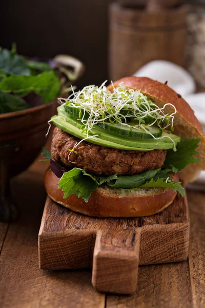 Grilled vegan bean burger with greens