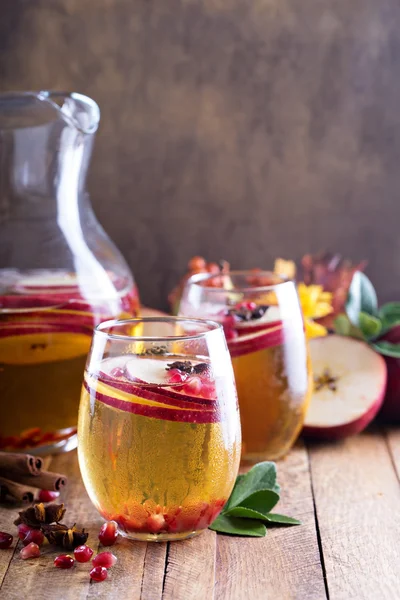 Fall sparkling drink with apple cider and pomegranate