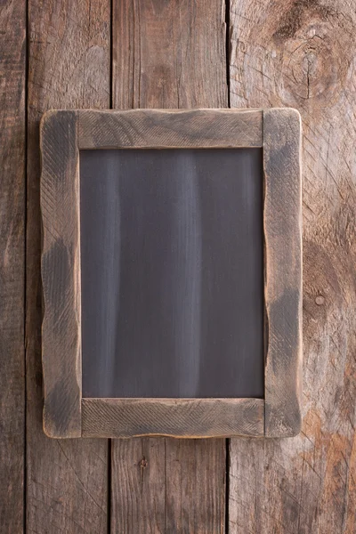 Wooden rustic background with a chalkboard