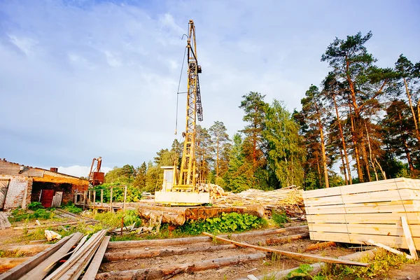 Powersaw bench - general view with many planks in the foreground