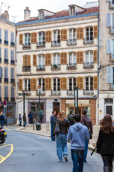 BAYONNE, FRANCE - APRIL 2, 2011: Native people walking in front