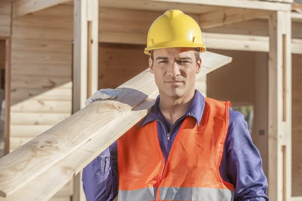 Construction worker building house