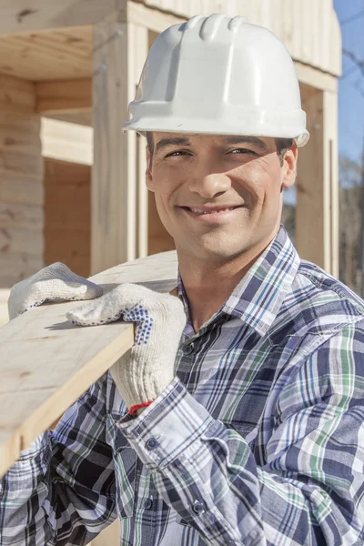 Construction worker building house