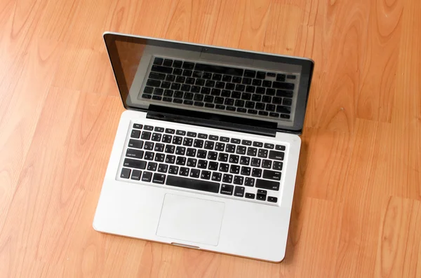 Laptop on wood table