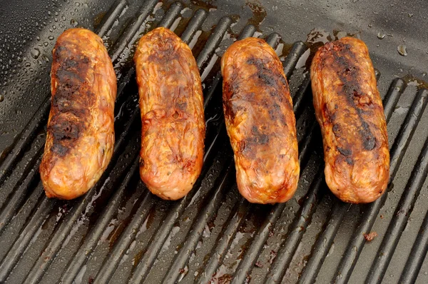 Fried Pork Sausages In A Griddle Frying Pan