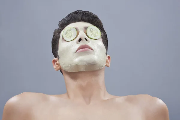 Man with  facial mask lying