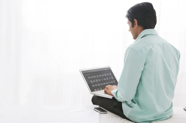 Young man using  laptop