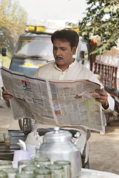 Man reading a newspaper