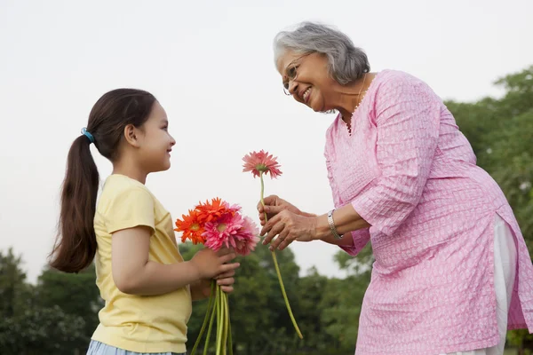 Grandmother accepting a flower