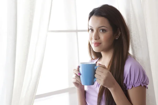 Woman with a mug of tea