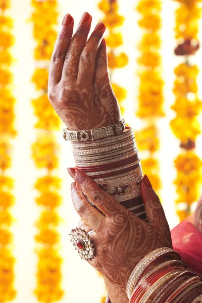 Hands in wedding bangles