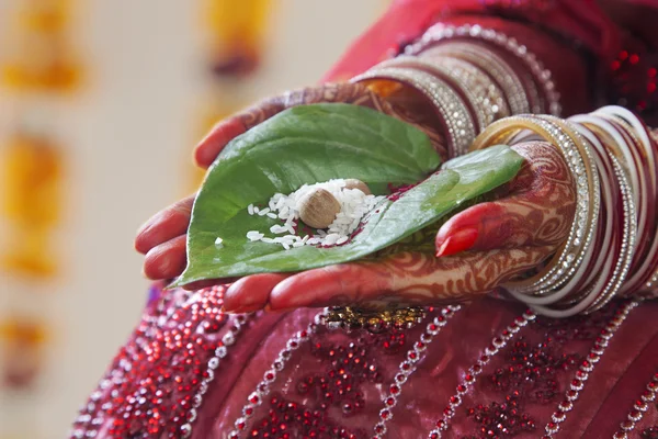 Hands performing marriage rituals