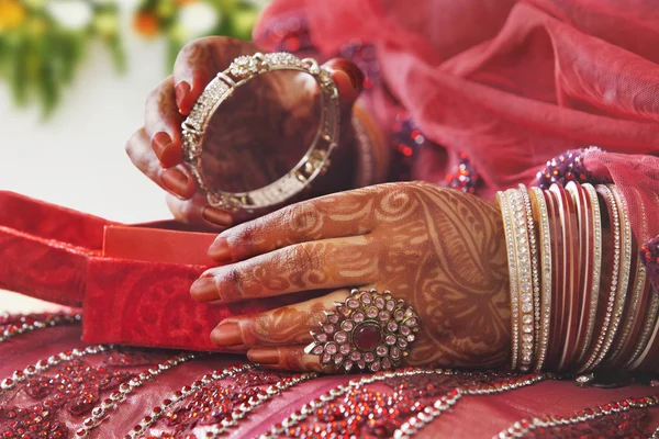 Bride\'s hands holding bangle