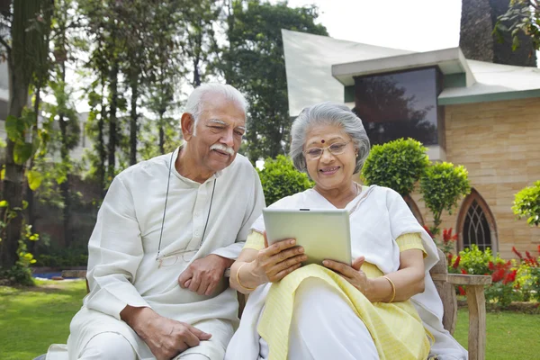 Couple using  digital tablet