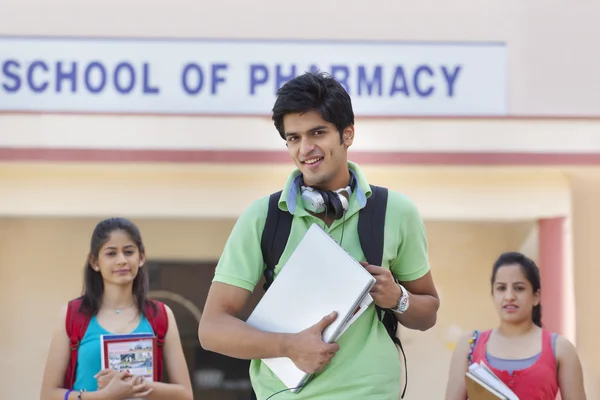 Students standing near pharmacy school