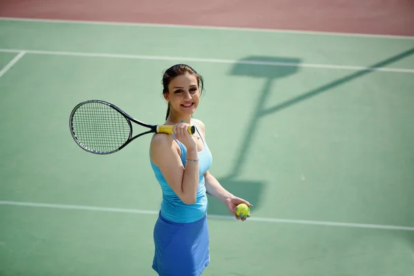 Young beautiful woman tennis player practice in tennis court