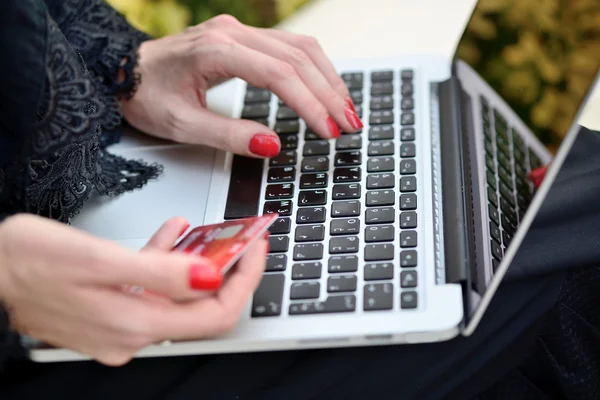 Emarati Arab Business woman making online payment