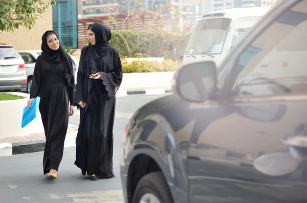 Emarati Arab Business women getting into the car