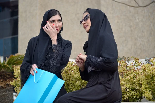 Emarati Arab women coming out of shopping