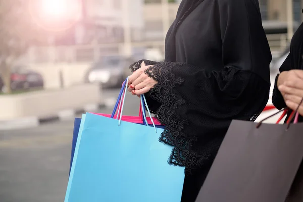 Emarati Arab women coming out of shopping