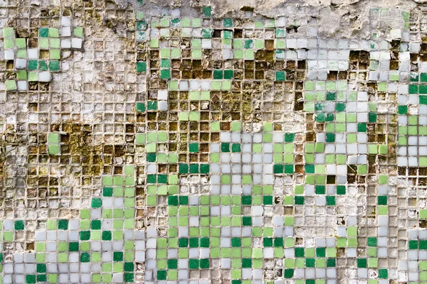 Grunge texture of broken tiles on old wall
