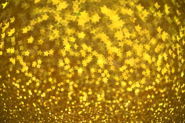 Festive Christmas background with stars. Abstract twinkled brigh