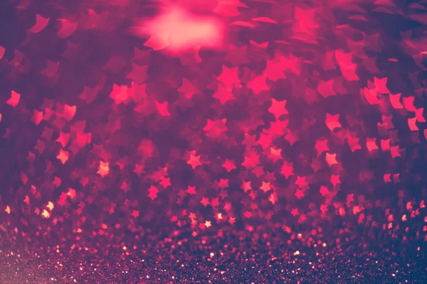 Festive Christmas background with stars. Abstract twinkled brigh