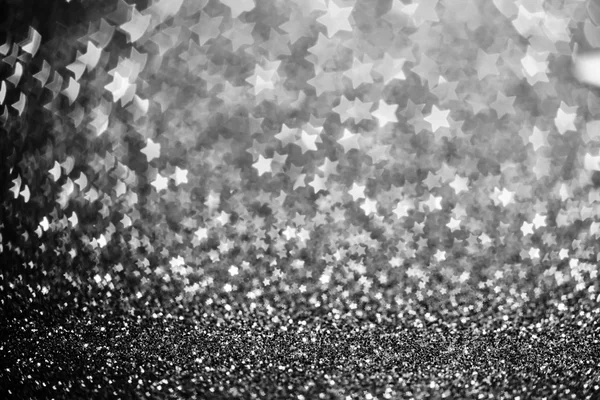 Festive Christmas background with stars. Abstract twinkled brigh