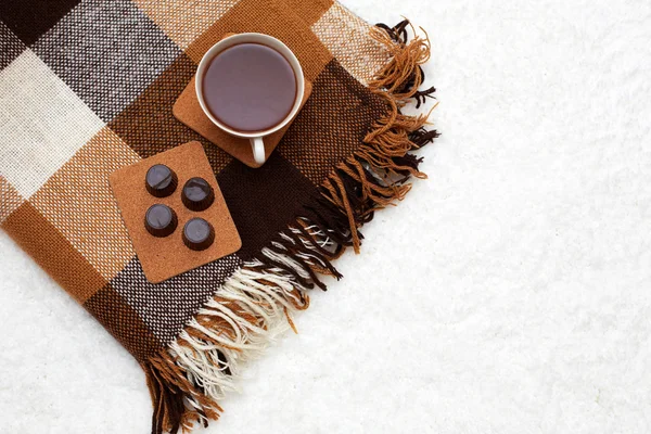 Cozy winter home background, cup of hot cocoa and chocolate, on