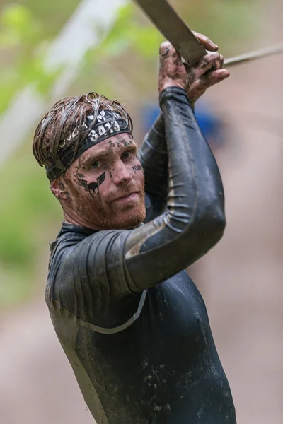 Front view on man on slack line at Tough Viking obstacle course