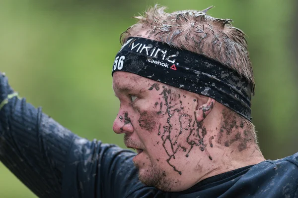 Face at slack line at Tough Viking obstacle course around Stockh