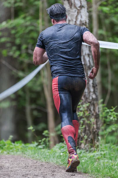 Man running from the slack line at Tough Viking obstacle course