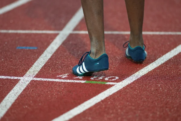 Shoe of an athlete sprinter on a track and field start at the IA