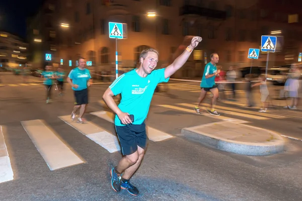 Happy male runner at the Midnight run in Stockholm (Midnattslopp