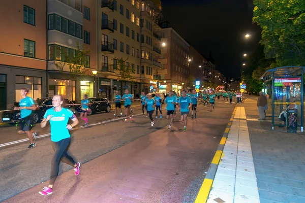 Happy runners at the Midnight run in Stockholm (Midnattsloppet)