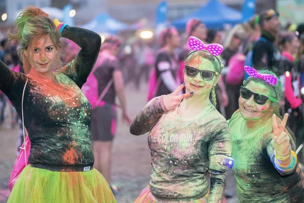 Friends posing at the Color Run Night Edition in Stockholm