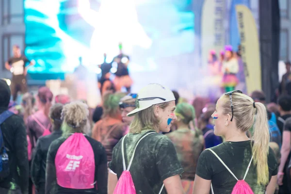 Colorful happy people at the Color Run Night Edition in Stockhol