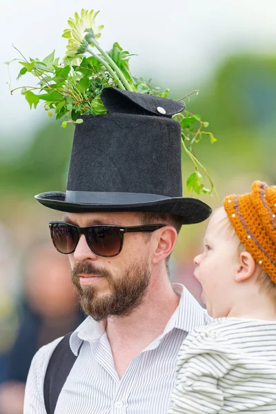 Traditional Hat parade with a man and child before the horse rac