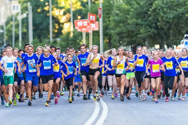 Runners just after the start at Lilla Midnattsloppet for aged 15